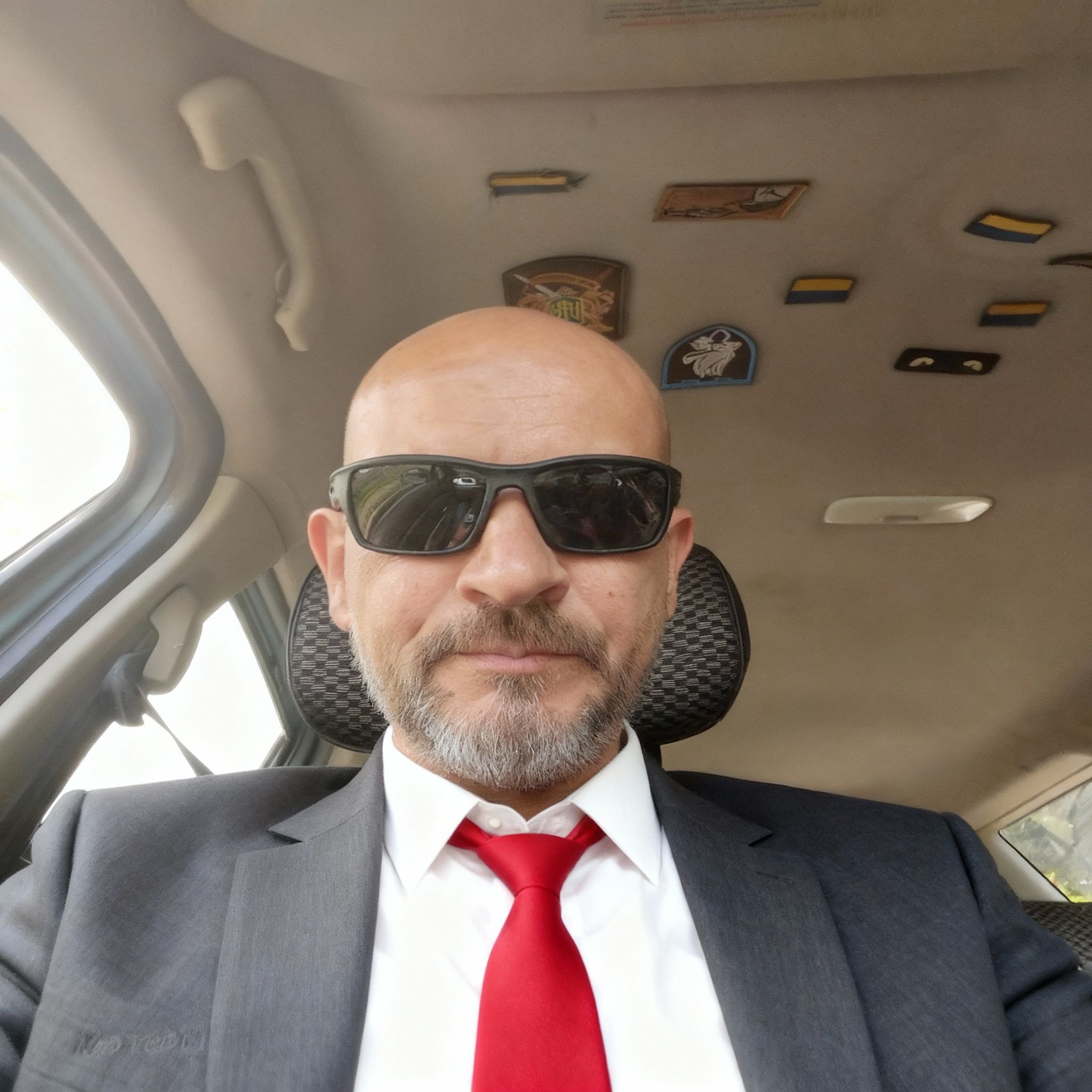 Super Besenok – Edit the portrait of the man to neatly trim his salt-and-pepper beard into a well-groomed short goatee style. Replace…