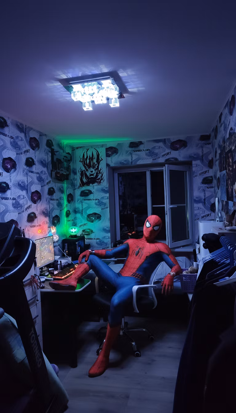 Ivan Durov – Add Spider-Man in his classic red and blue suit sitting casually in the white mesh office chair, positioned as if he'…