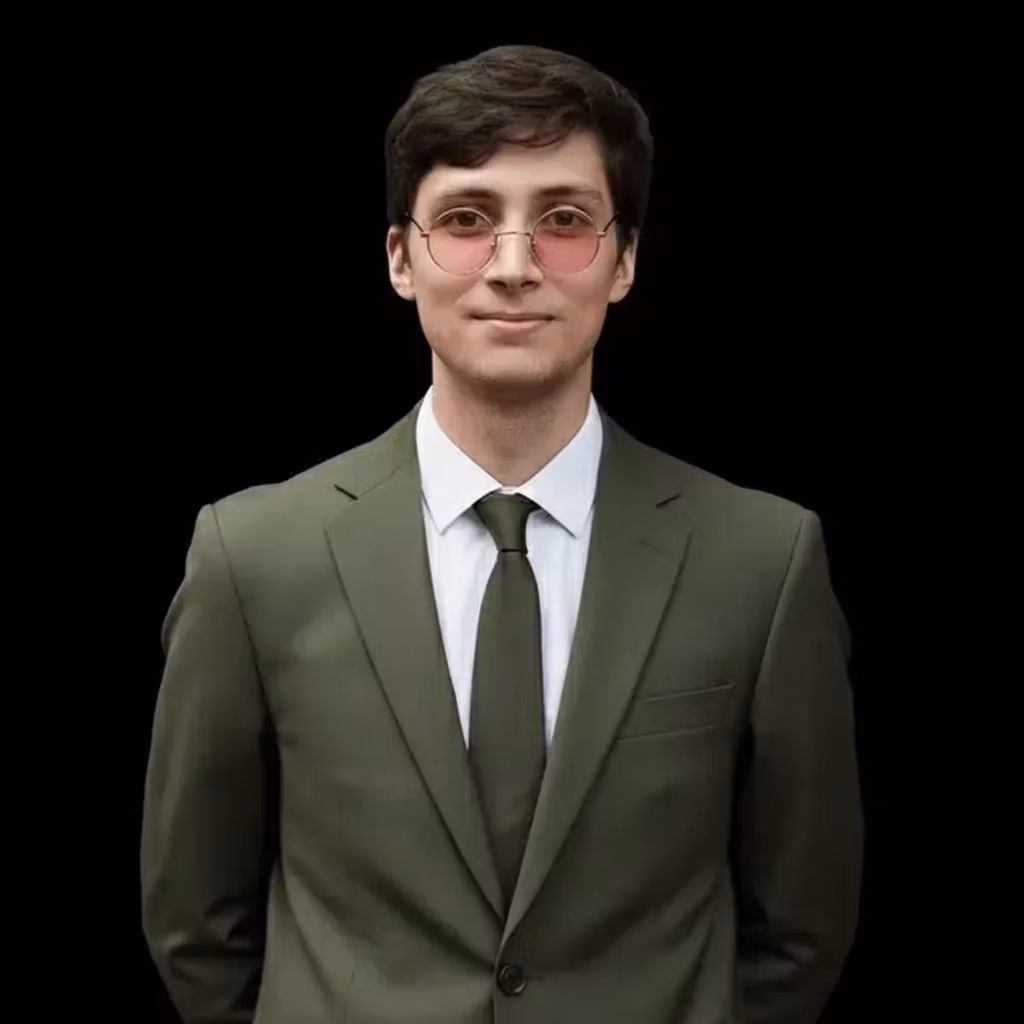 Ученик – Adjust the portrait of the young man with pink glasses in green suit to a square aspect ratio, cropping tightly to ce…