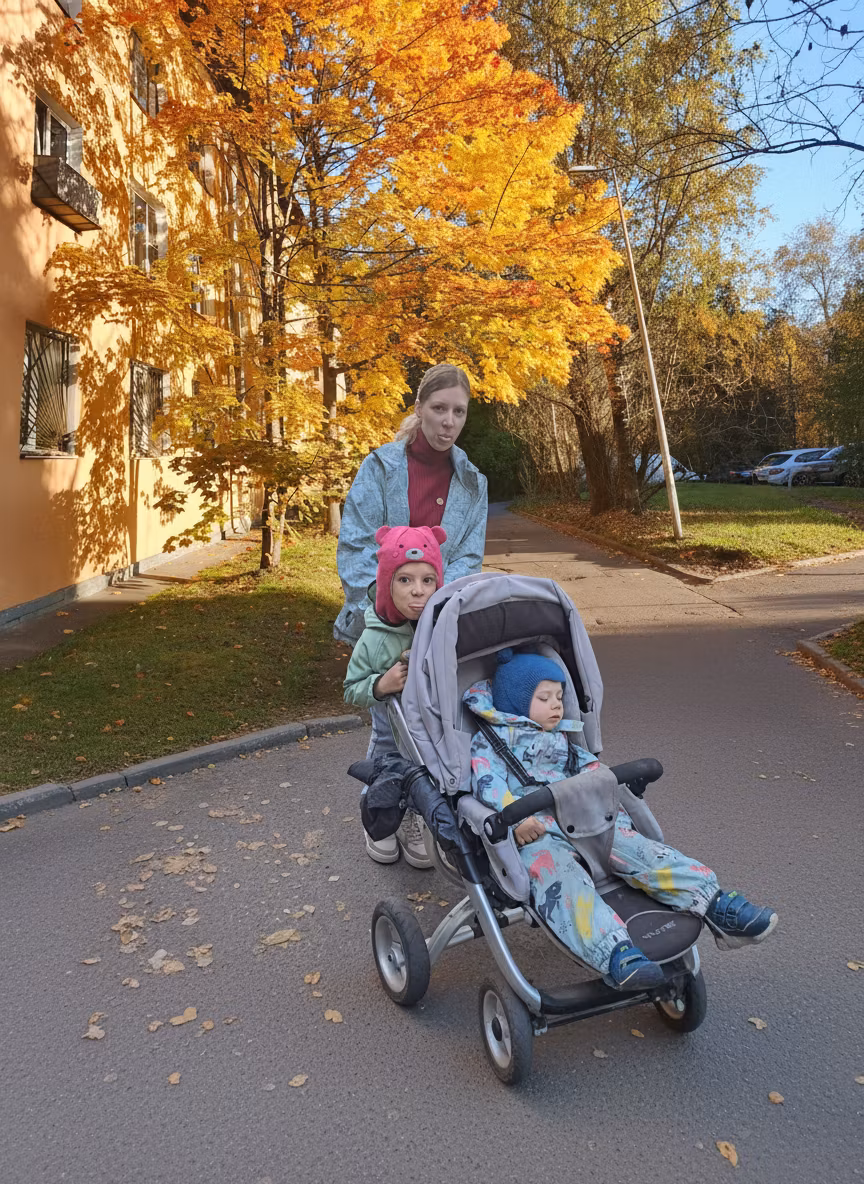 Julie Mirielle – Extract the family group from the first image: the light-haired woman in a blue patterned jacket and red turtleneck, …