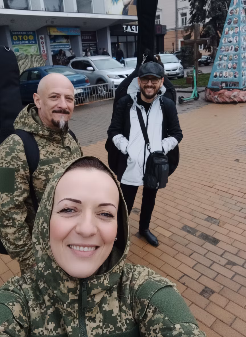 Чорний лебідь – Transform all three musicians in the image by dressing them in military pixel camouflage uniforms without any insigni…