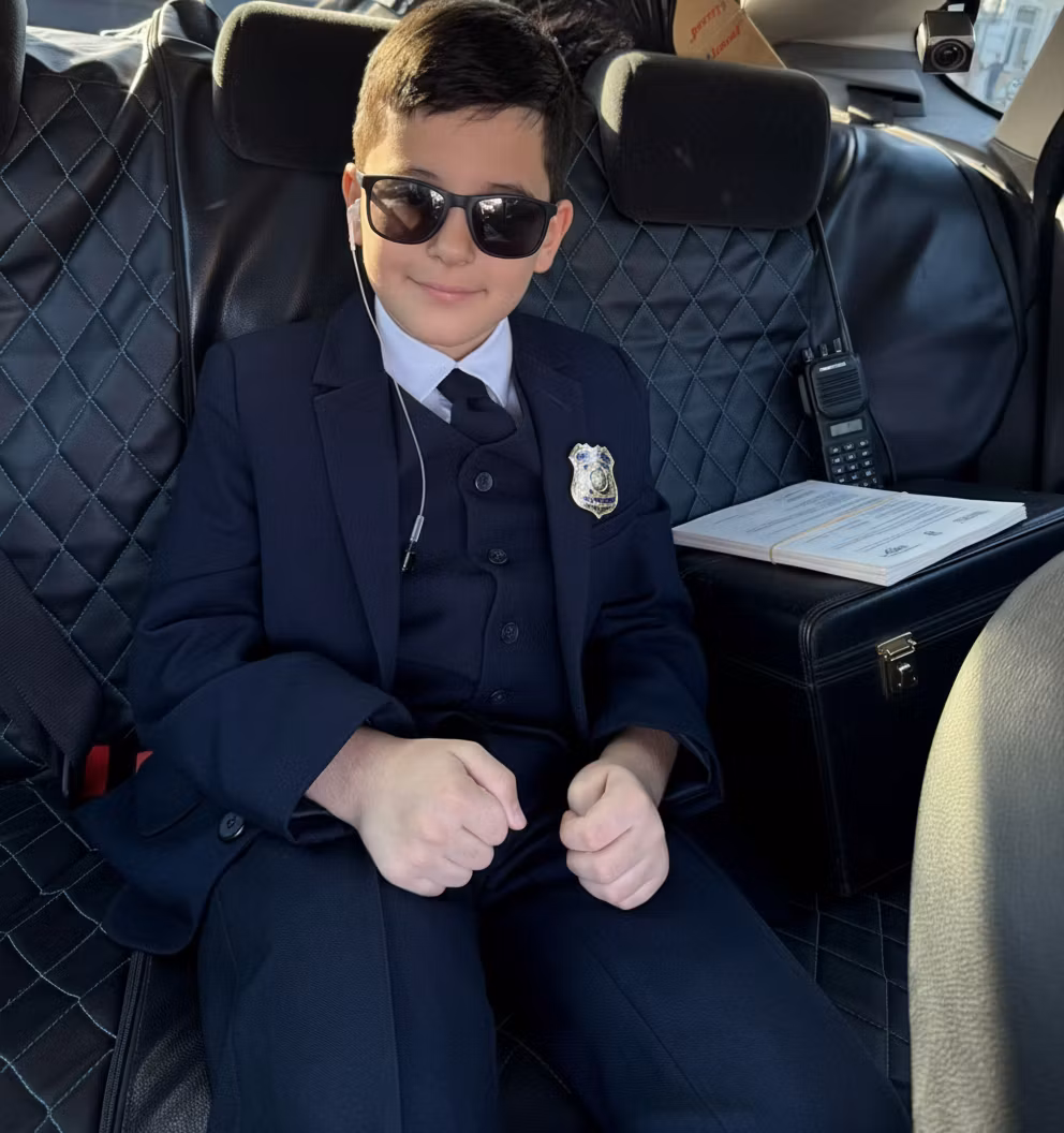 LIte Flex – Transform this young person into a professional US Secret Service agent. Enhance the formal black suit to look more t…